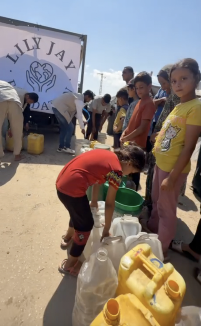 Giving water aid in Gaza Palestine 